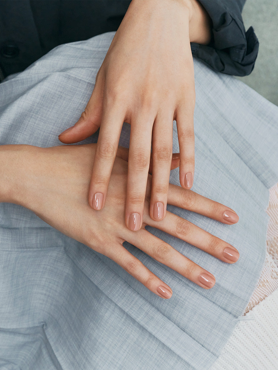 Finger Suit Demure rosy nude-brown nail polish in a soft warm taupe neutral shade